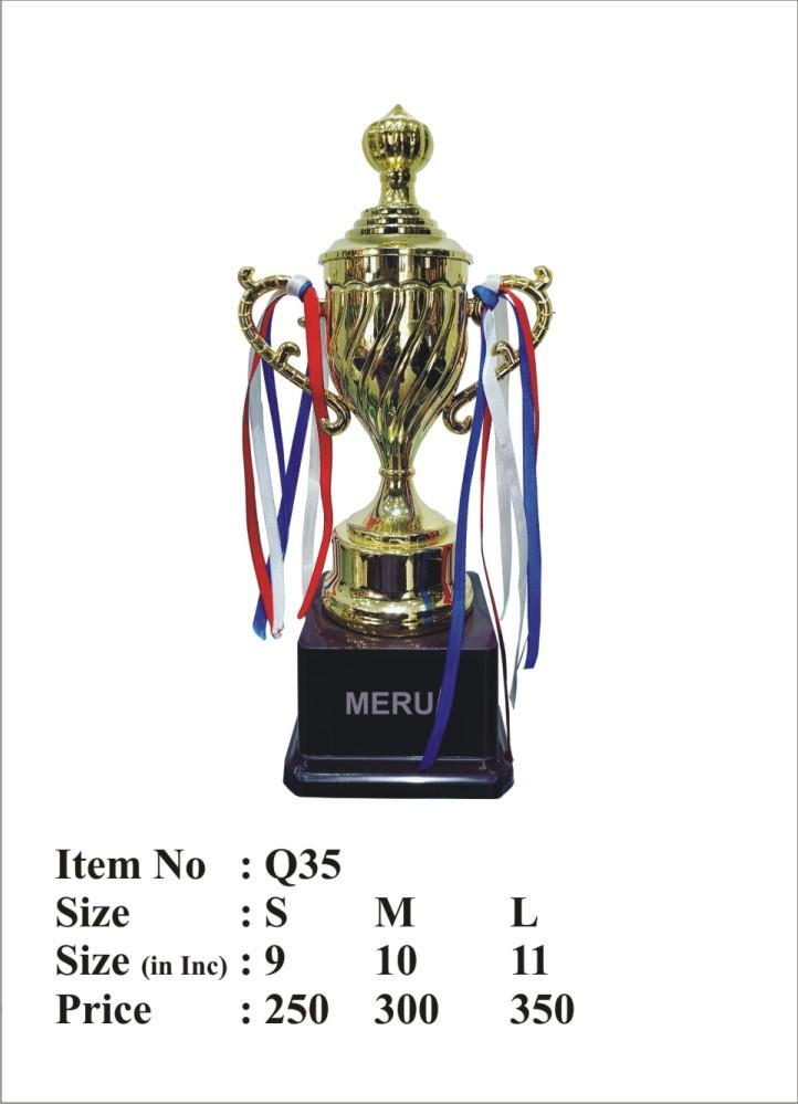 Gold trophy cup with red; white; and blue ribbons on a black base. Award trophy.