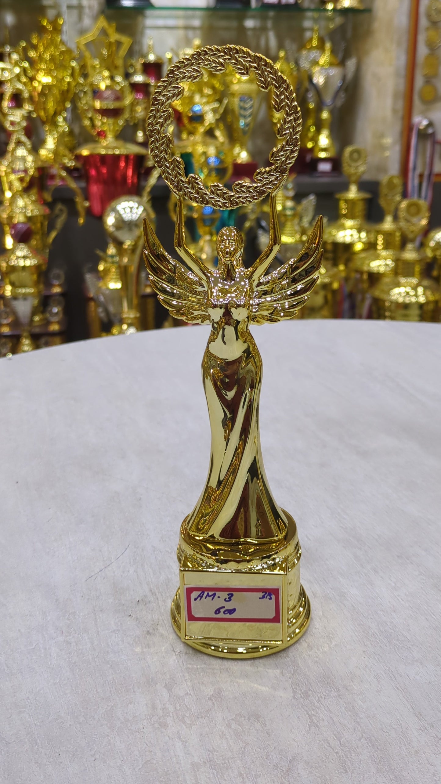 Gold winged victory trophy