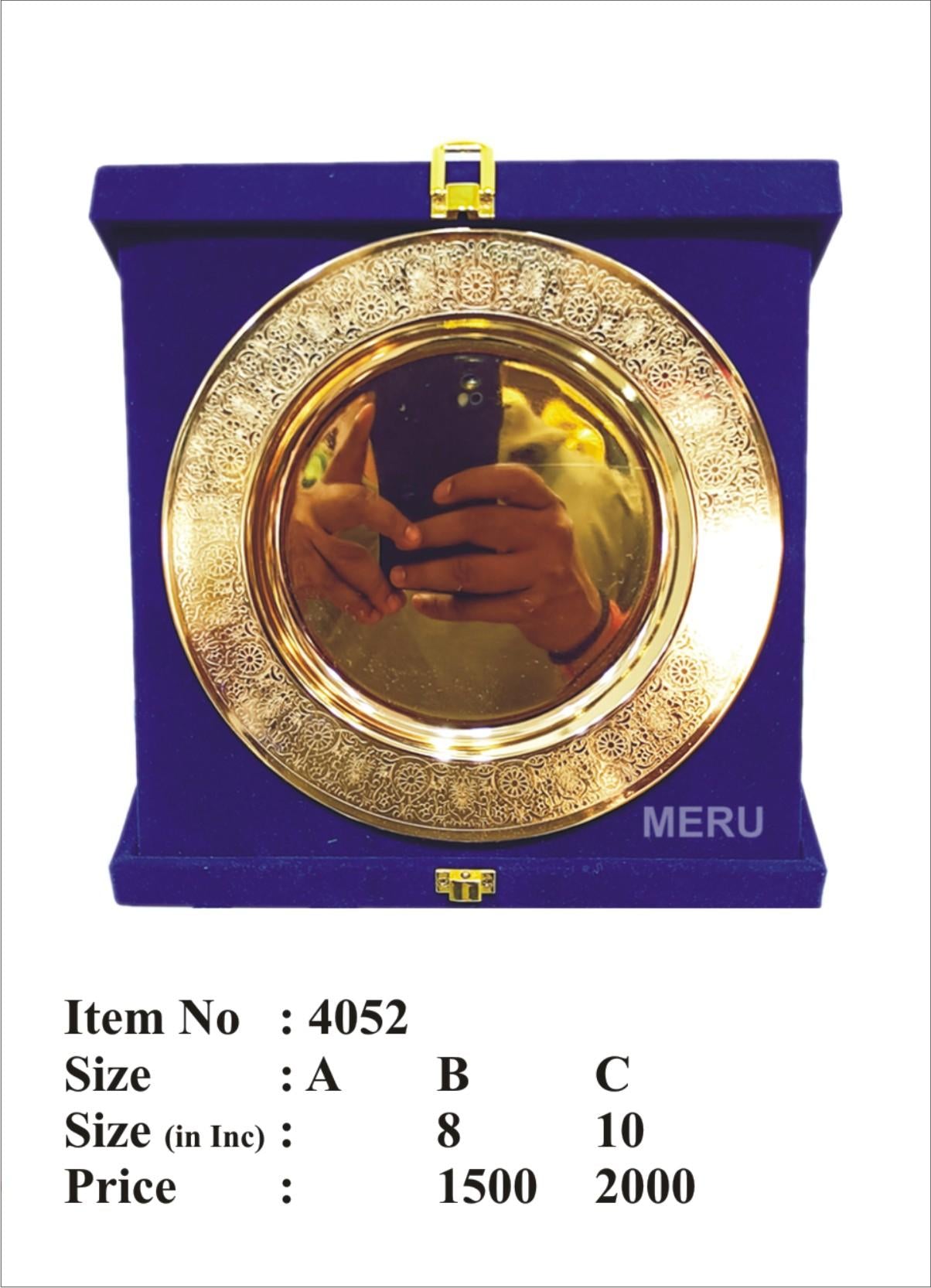 Intricate wooden memento with a polished gold surface and blue velvet case.