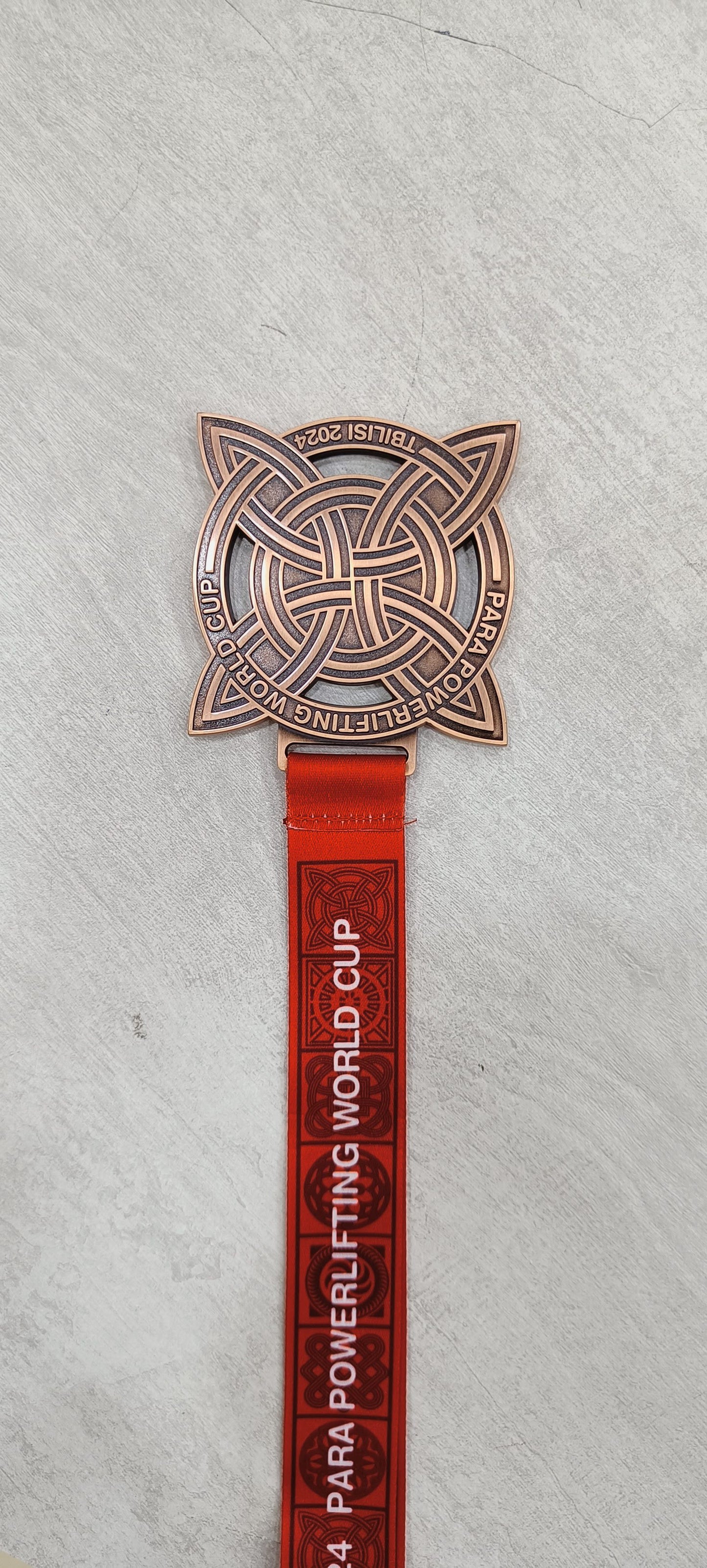 Bronze Para Powerlifting Medal with Red Lanyard