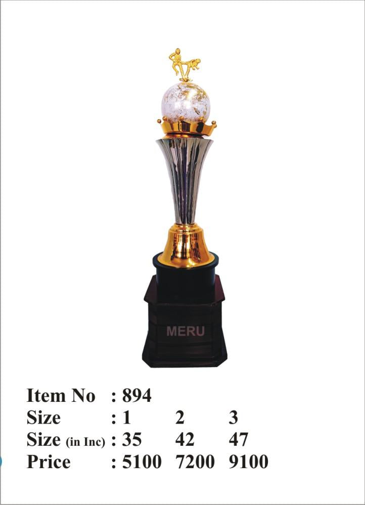 Silver and gold metal sports trophy with globe and figures; perfect for awards and recognition.