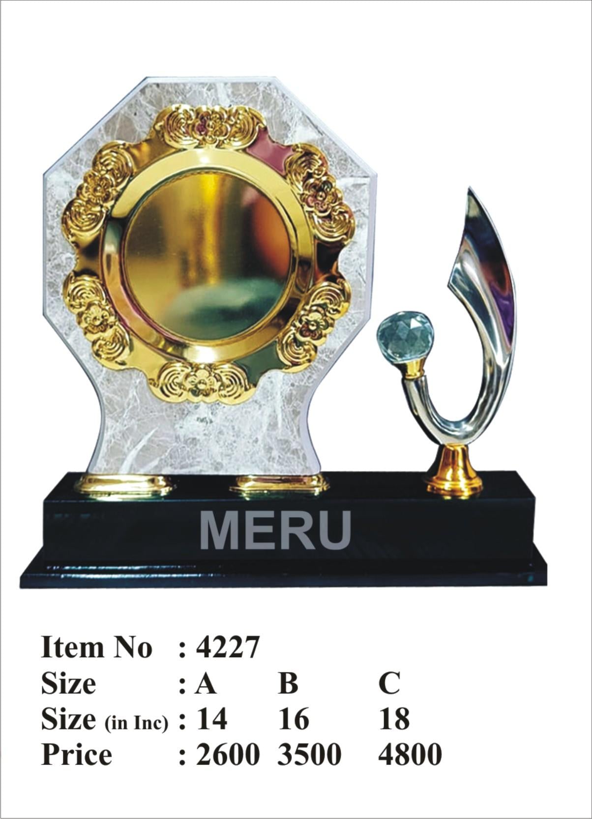 Elegant wooden memento featuring gold; silver; and a green gem.
