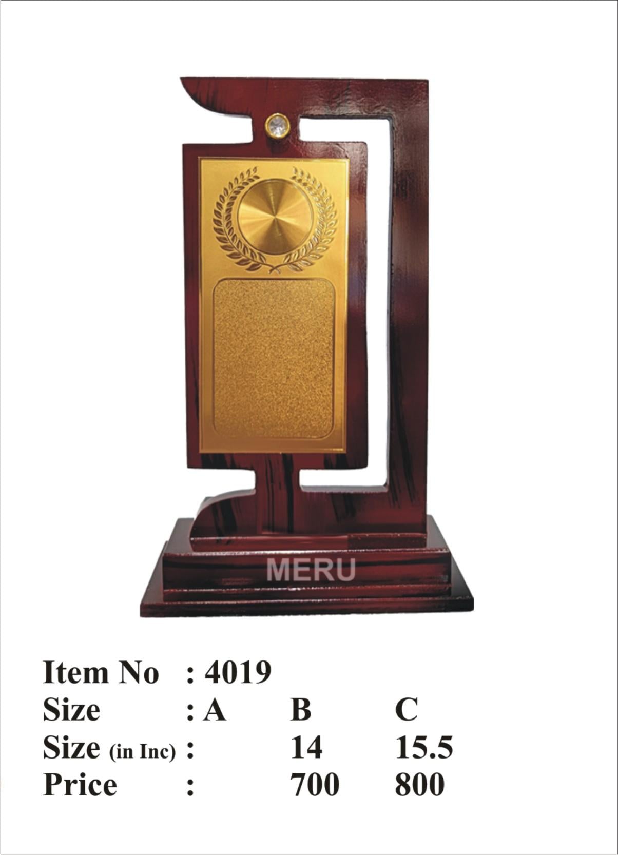 Wooden memento with gold plaque and gem detail.
