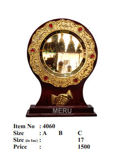 Ornate wooden trophy with gold plate.