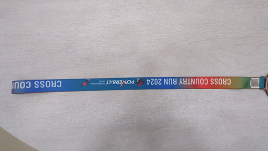 Custom cross country run medal with rainbow lanyard. Perfect award for recognizing achievement in 2024 sports events.