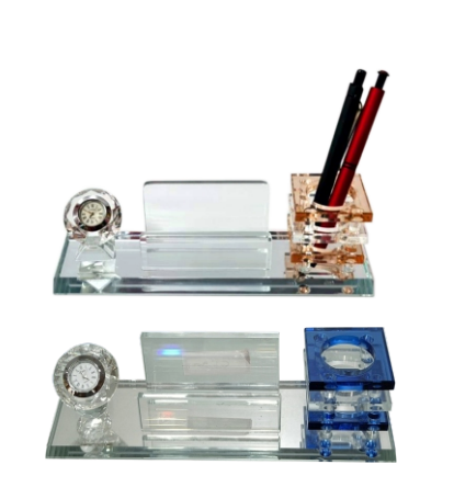 Crystal desk set with clock, pen holder, and other items on a white background