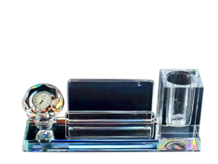 Crystal desk set with clock, pen holder, and phone stand on a white background