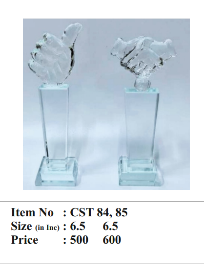 Close-up of crystal trophy featuring a handshake and thumbs up