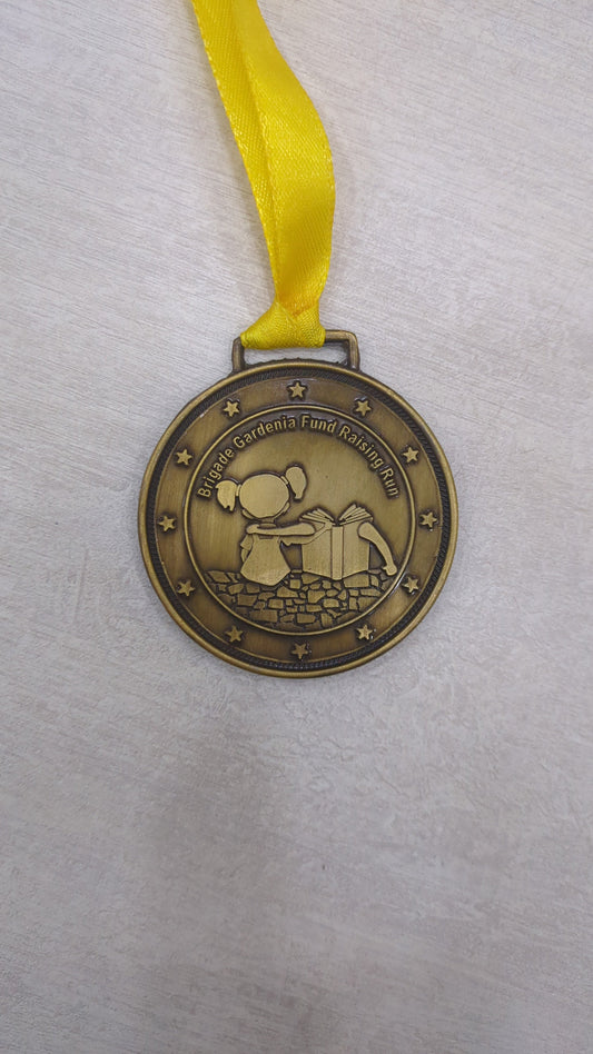 Custom academic medal for students featuring a girl reading. Perfect for awards related to sports and academic achievements.