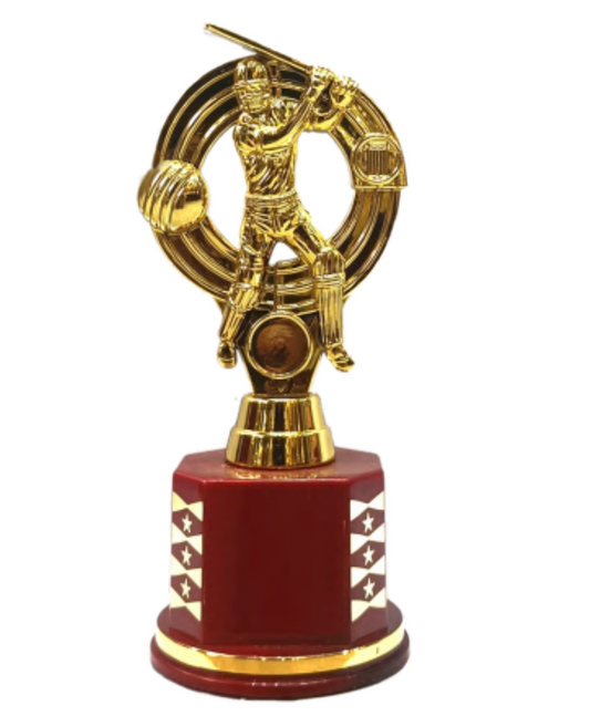 Trophy with a gold figure of a baseball player on a red base