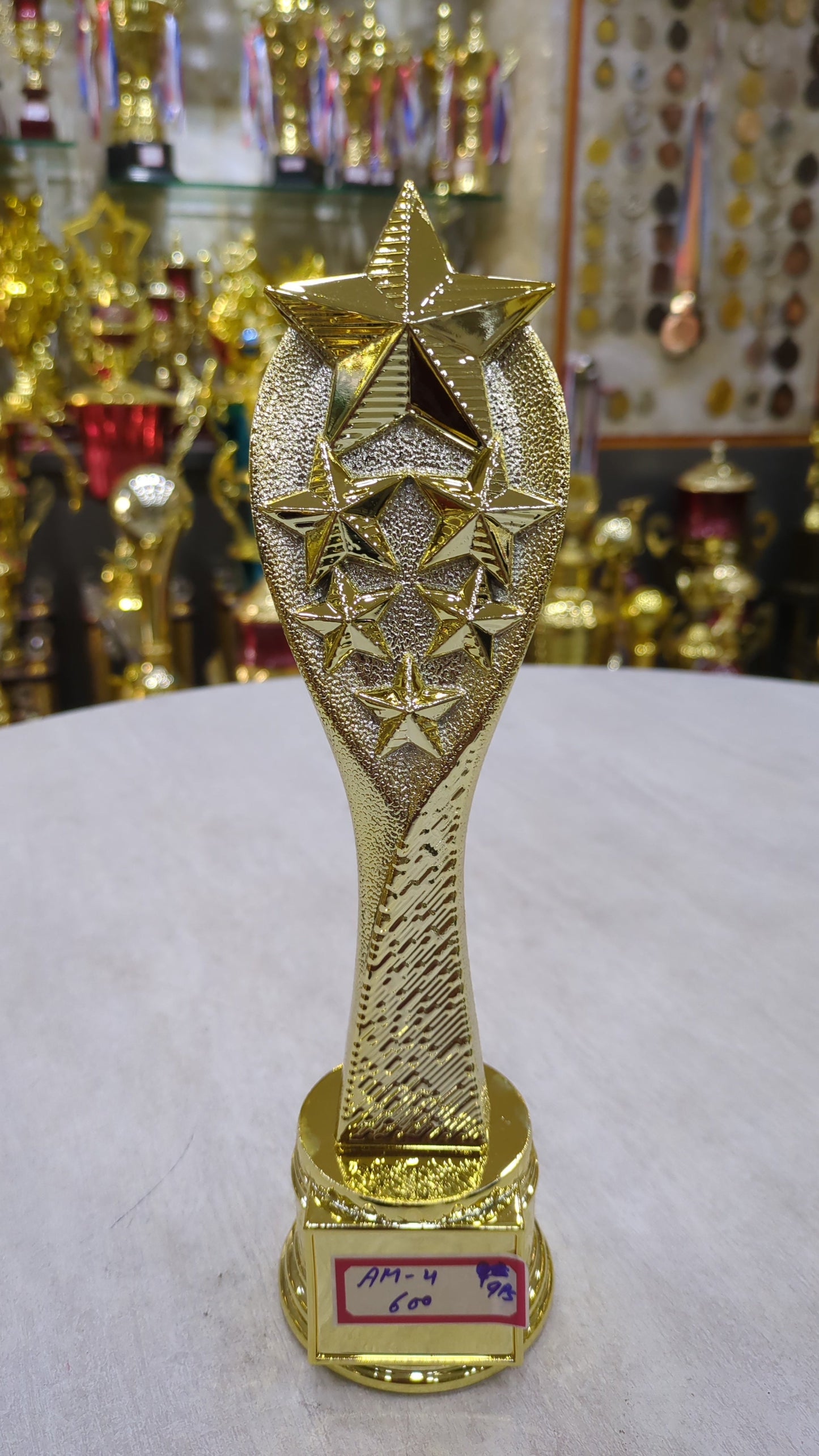 Gold star achievement award trophy