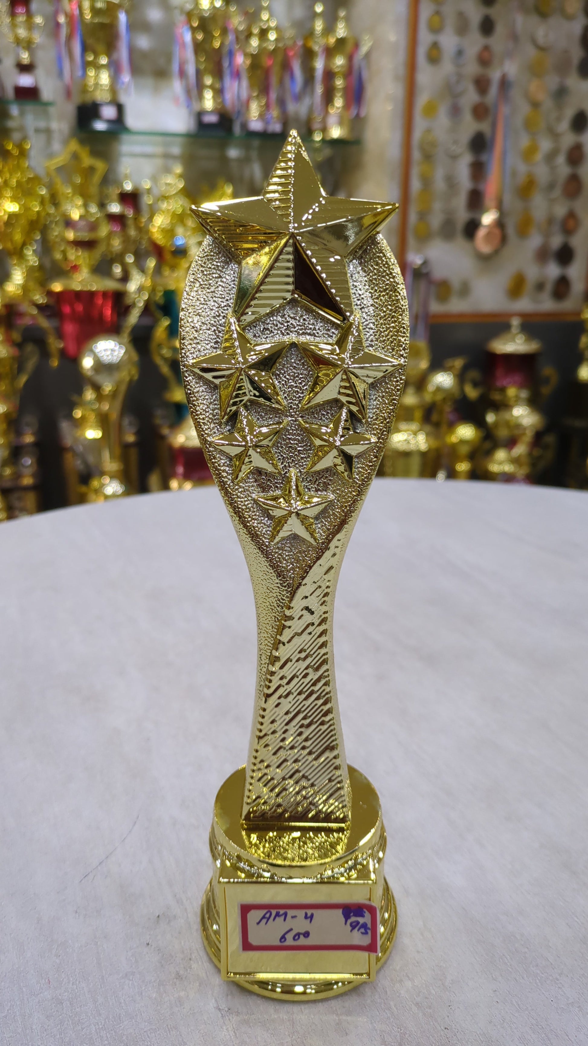 Gold star achievement award trophy